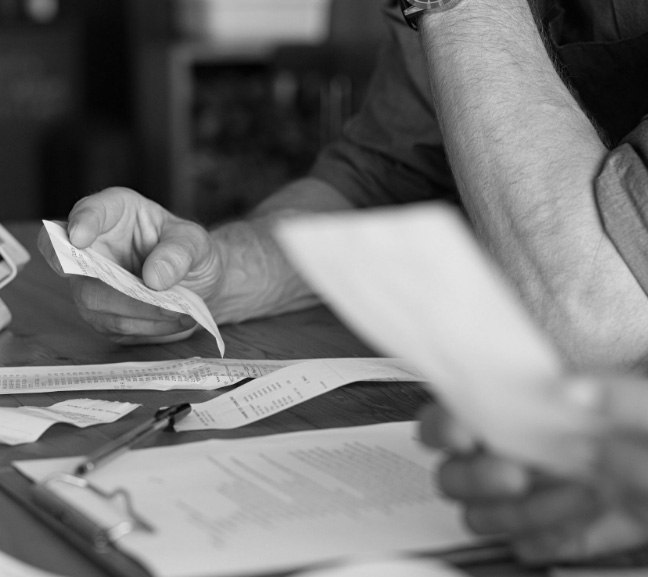 photo of 2 people meeting and going over documents