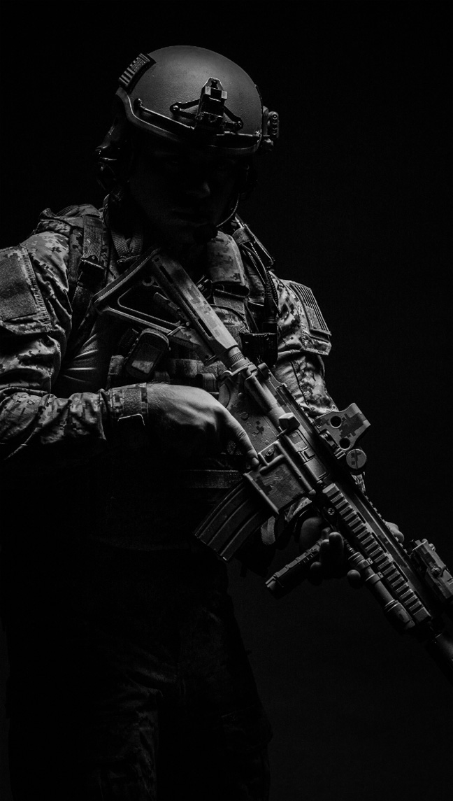 photo of an armed soldier in full combat gear