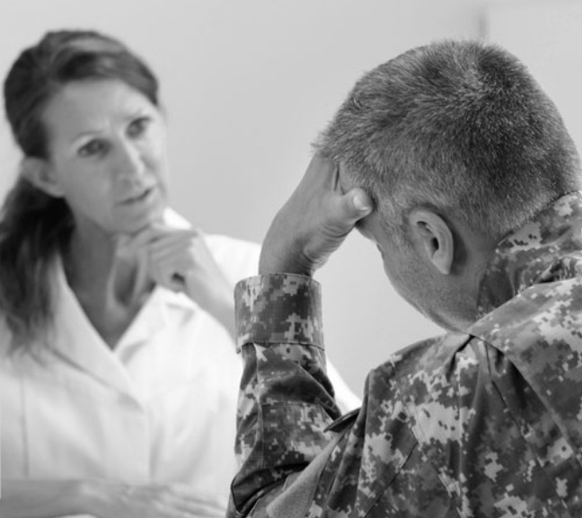 military personnel talking with a healthcare professional