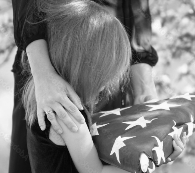 child holding a USA flag representing a military personnel who has died