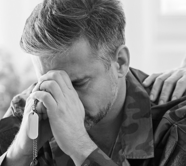 photo of a military veteran who has suffered a loss and looks sad